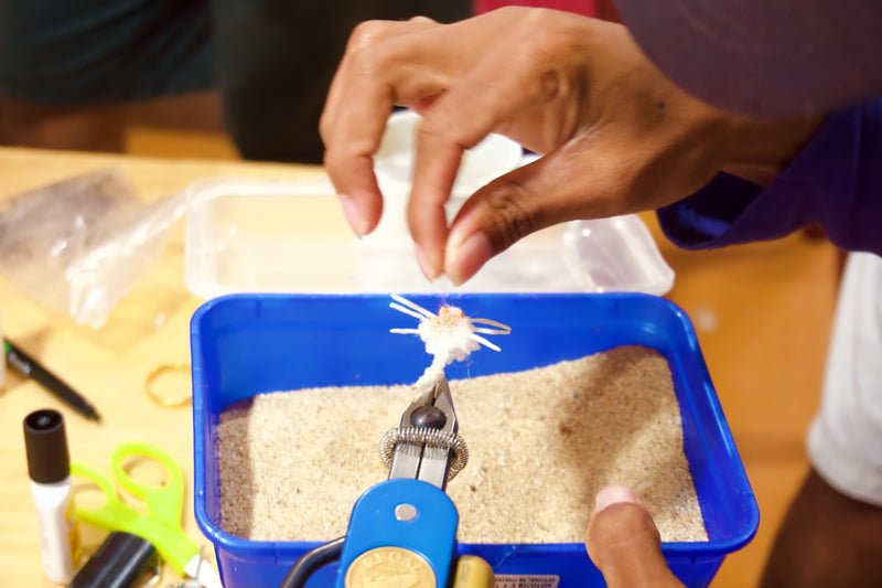 Our expert tyer based in Honduras crafting a white sand body mantis crab