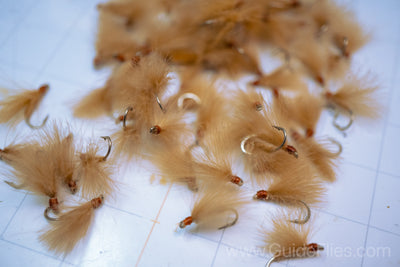 Fishing fly tied with CDC Feathers spun together for the body with matching CDC feathers for the wings