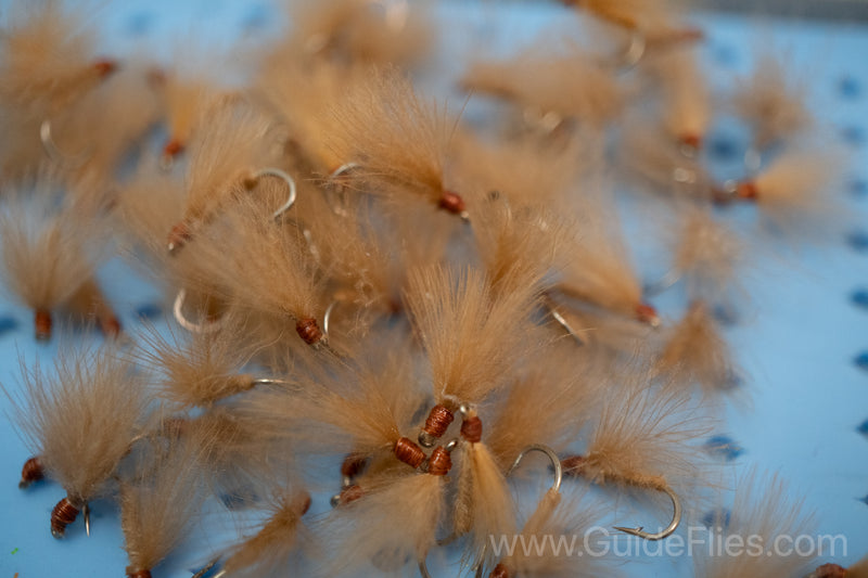 Fishing fly tied with CDC Feathers spun together for the body with matching CDC feathers for the wings