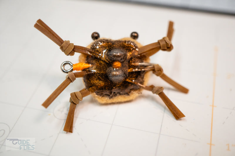 Belly of brown combo crab and black beaded eyes with matching epoxy resin