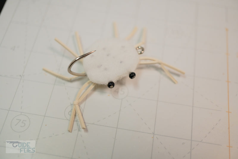 White with black dots combo crab with rubber legs and Umpqua hooks with black beaded eyes