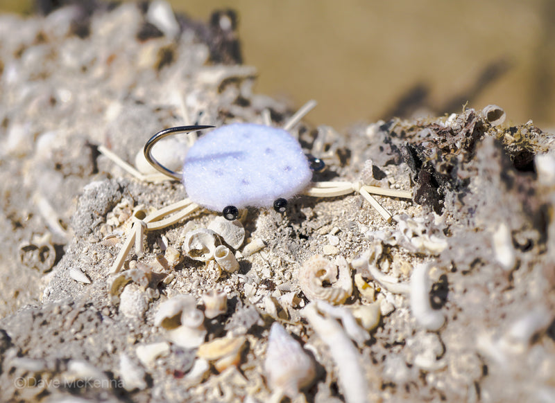 White with black dots on back combo crab with rubber legs and Umpqua hooks with black beaded eyes