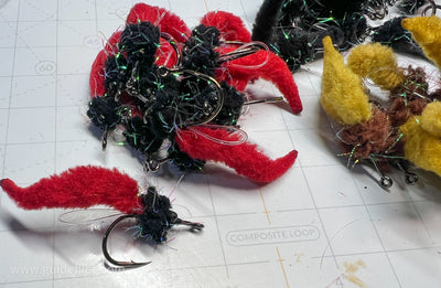 Bundle of the Dave's Tarpon worm colored black and red tails made with Guard hair chenille