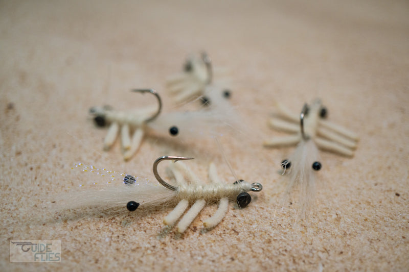 White Abaco Mantis tied with the legs of a Flexo Crab, natural Angora yarn body and Polar Fiber that blend with any bottom. A few strands of Krystal Flash add just the right amount of sparkle. Applied with small black beady eyes with a size