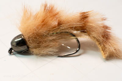 Synthetic Faux Fox Zonker designed by Dave McKenna combination of synthetic rabbit and body wrap from Semperfli tied on a Firehole barbless #6 streamer hook with a matching brass conehead