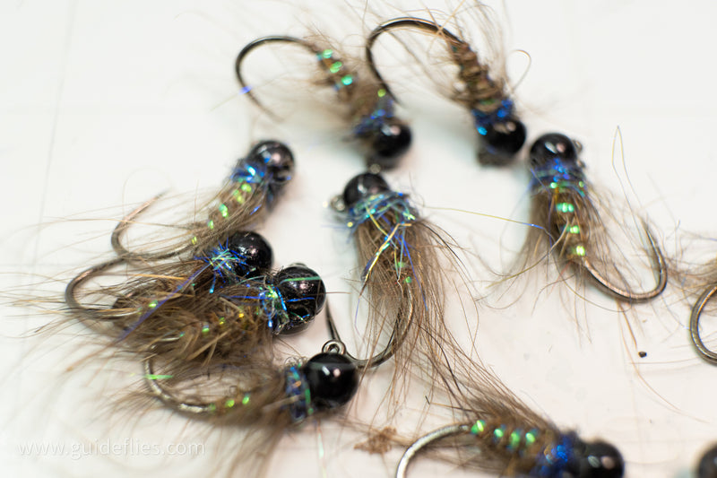 Light blue Ice Dub, a CDC soft hackle collar, and hare&