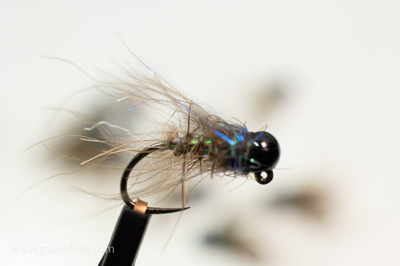 Light blue Ice Dub, a CDC soft hackle collar, and hare&