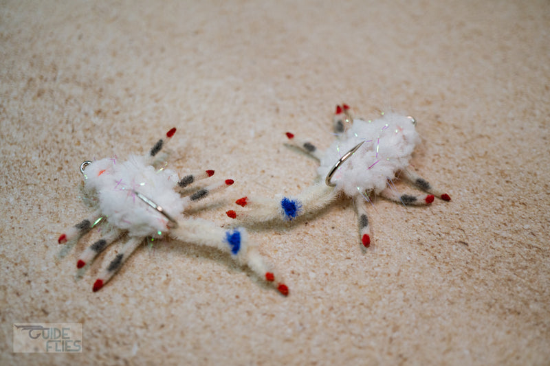 Body Guard Crab tied with white material using a Umpqua X-Series XS410 Flats hook  design has a prominent claw