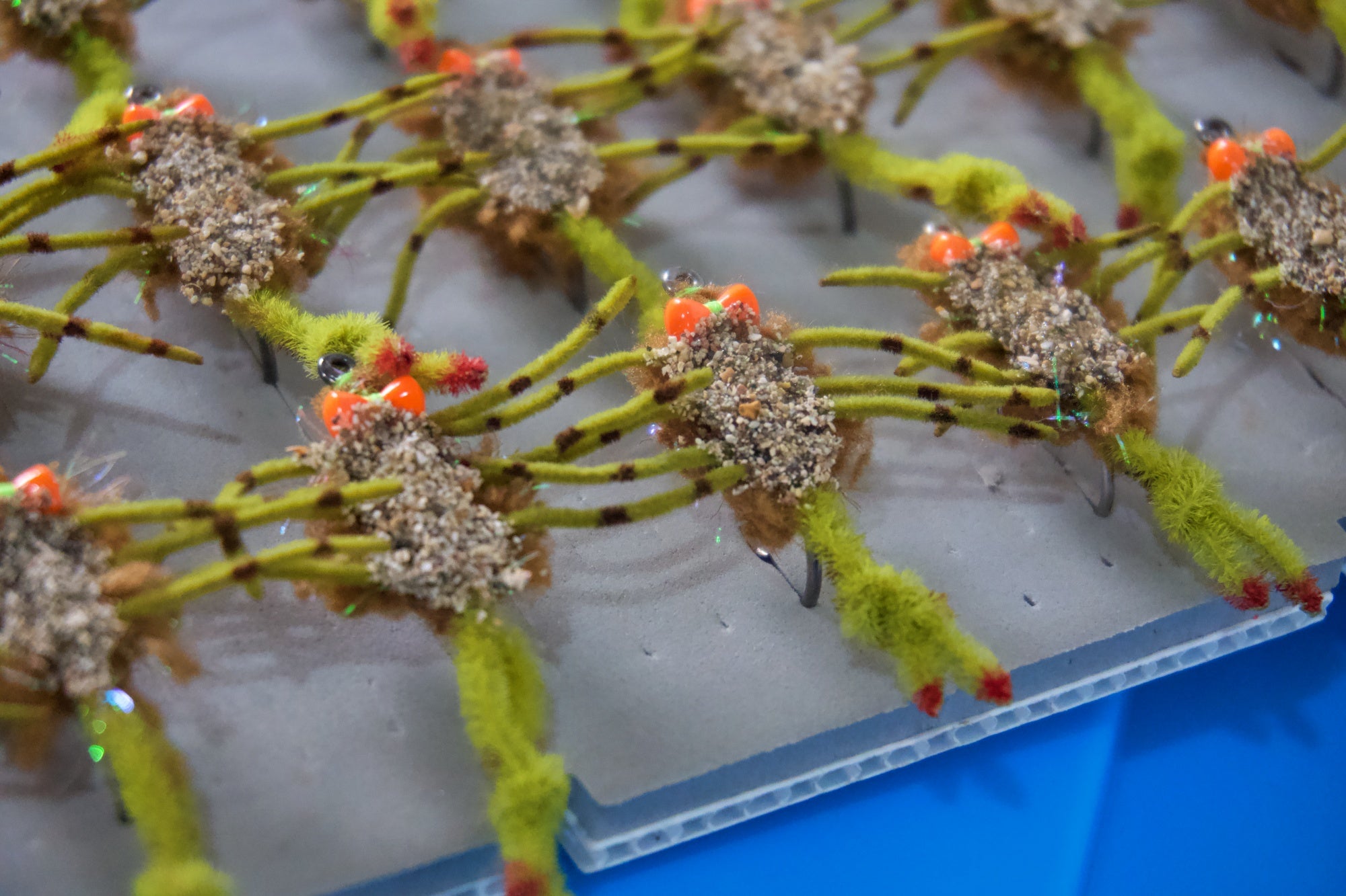 Body Guard Crab tied with tan material for the body and green for the legs using a Umpqua X-Series XS410 Flats hook design has a prominent claw with sand belly