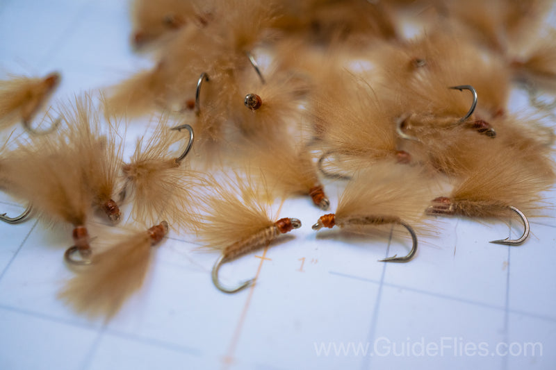 Fishing fly tied with CDC Feathers spun together for the body with matching CDC feathers for the wings