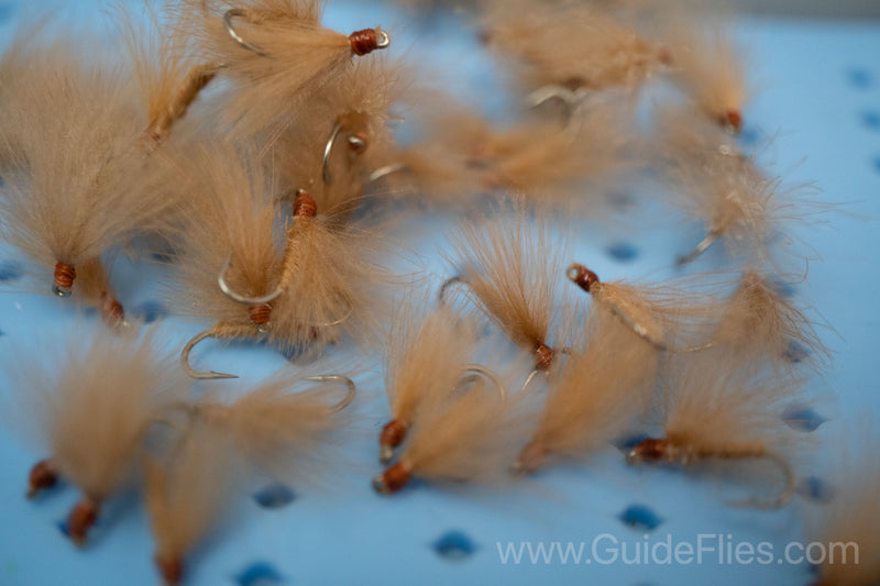 Fishing fly tied with CDC Feathers spun together for the body with matching CDC feathers for the wings