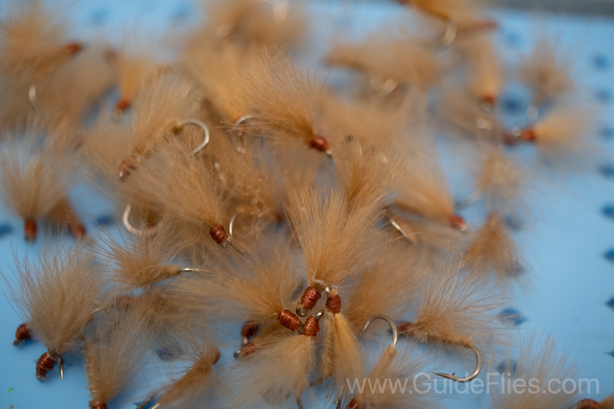 Fishing fly tied with CDC Feathers spun together for the body with matching CDC feathers for the wings