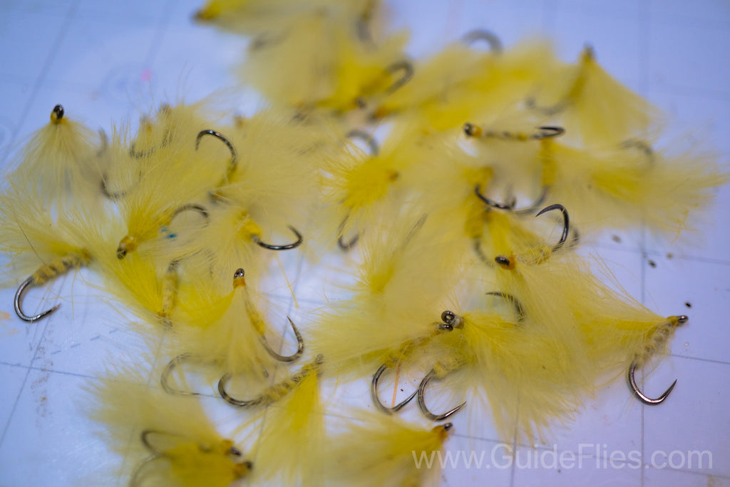 Fishing fly tied with CDC Feathers spun together for the body with matching CDC feathers for the wings
