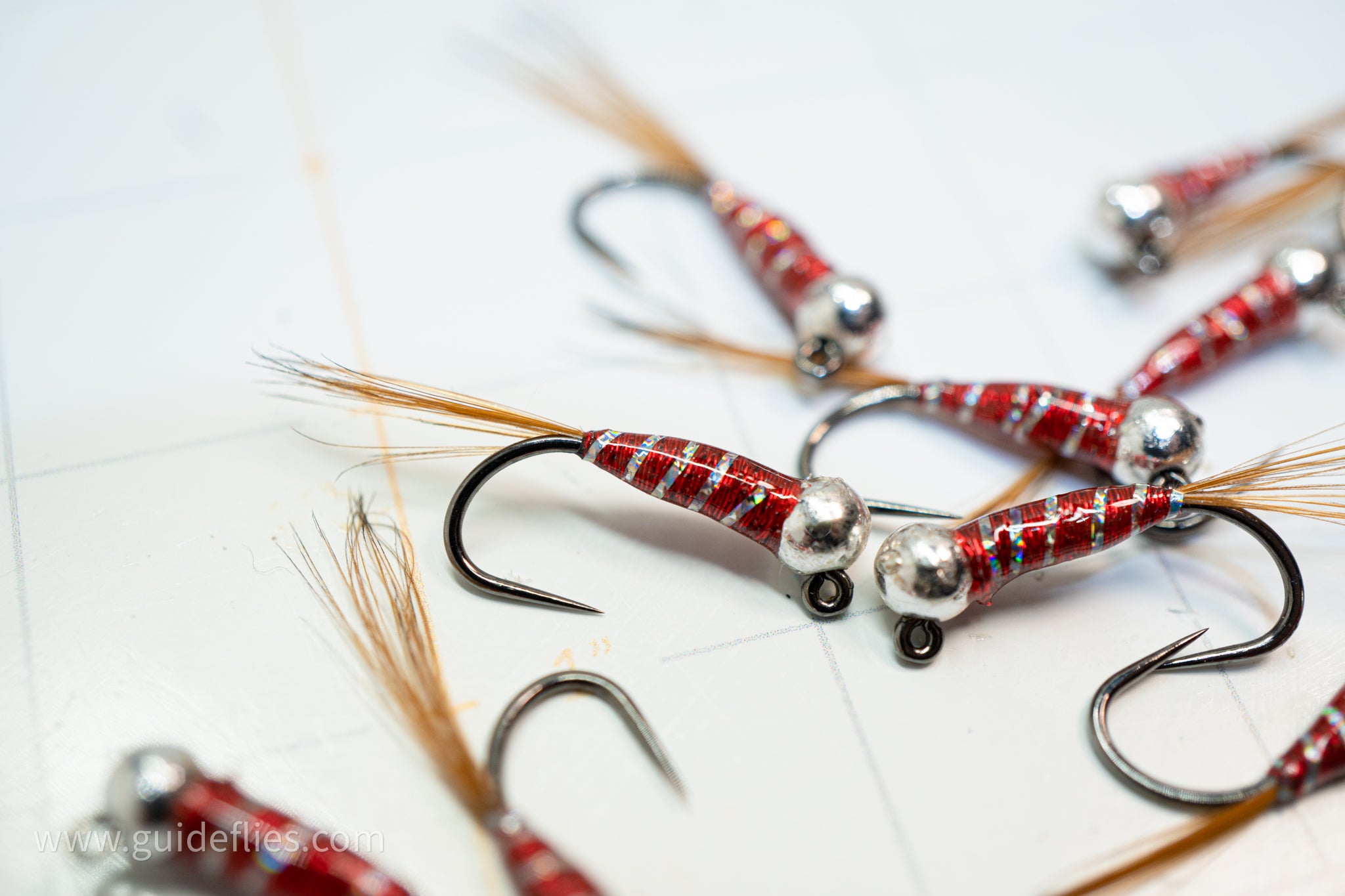 Red body with a silver rib fitted with a heavy tungsten bead