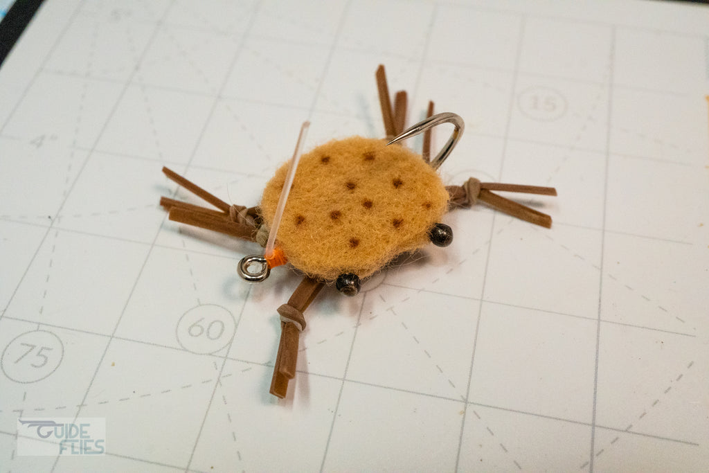 Brown combo crab with darker brown dots, matching colored rubber legs and Umpqua hooks with black beaded eyes