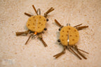 Brown combo crab with darker brown dots, matching colored rubber legs and Umpqua hooks with black beaded eyes