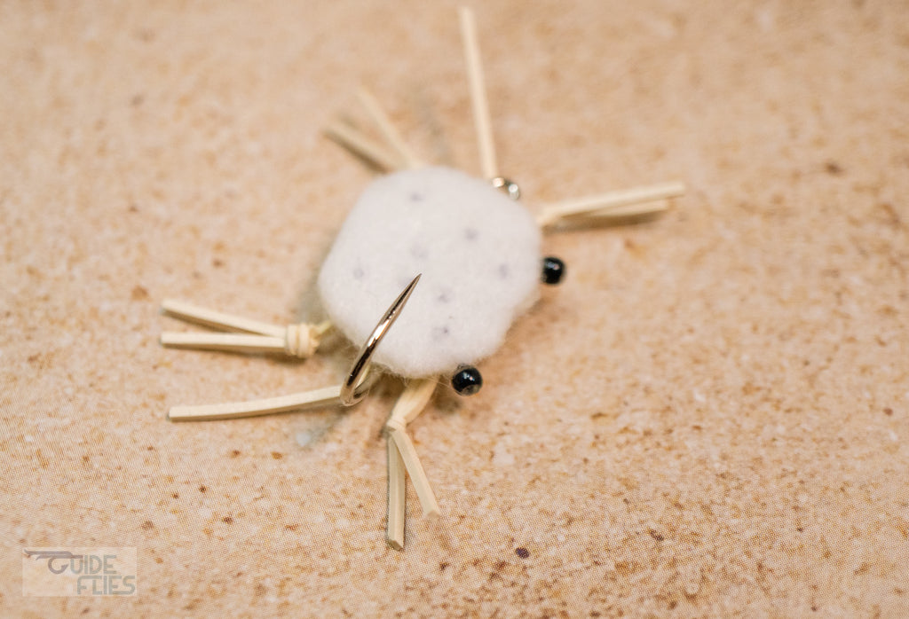 White with black dots combo crab with rubber legs and Umpqua hooks with black beaded eyes