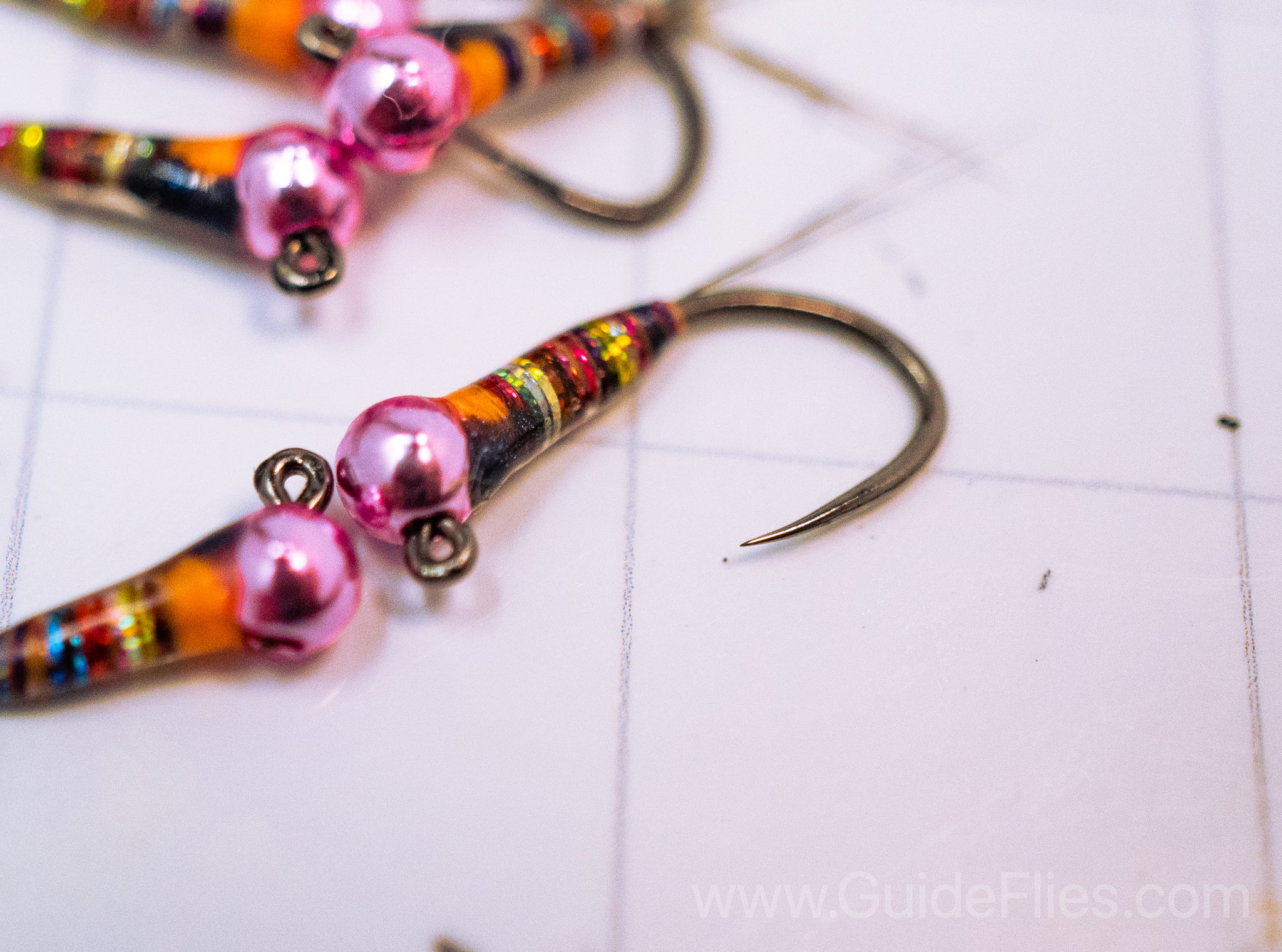 Full rainbow spectrum detailed in the dark rainbow perdigon with a epoxy resin attached to a pink tungsten bead head