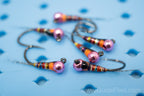 Full rainbow spectrum detailed in the dark rainbow perdigon with a epoxy resin attached to a pink tungsten bead head
