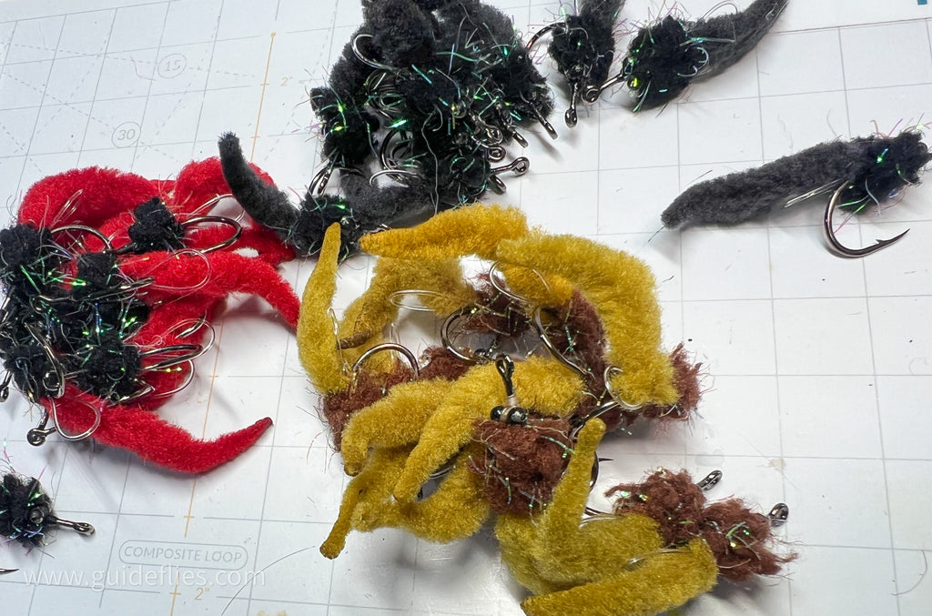 Bundle of the Dave's Tarpon worm colored brown and olive tails made with Guard hair chenille
