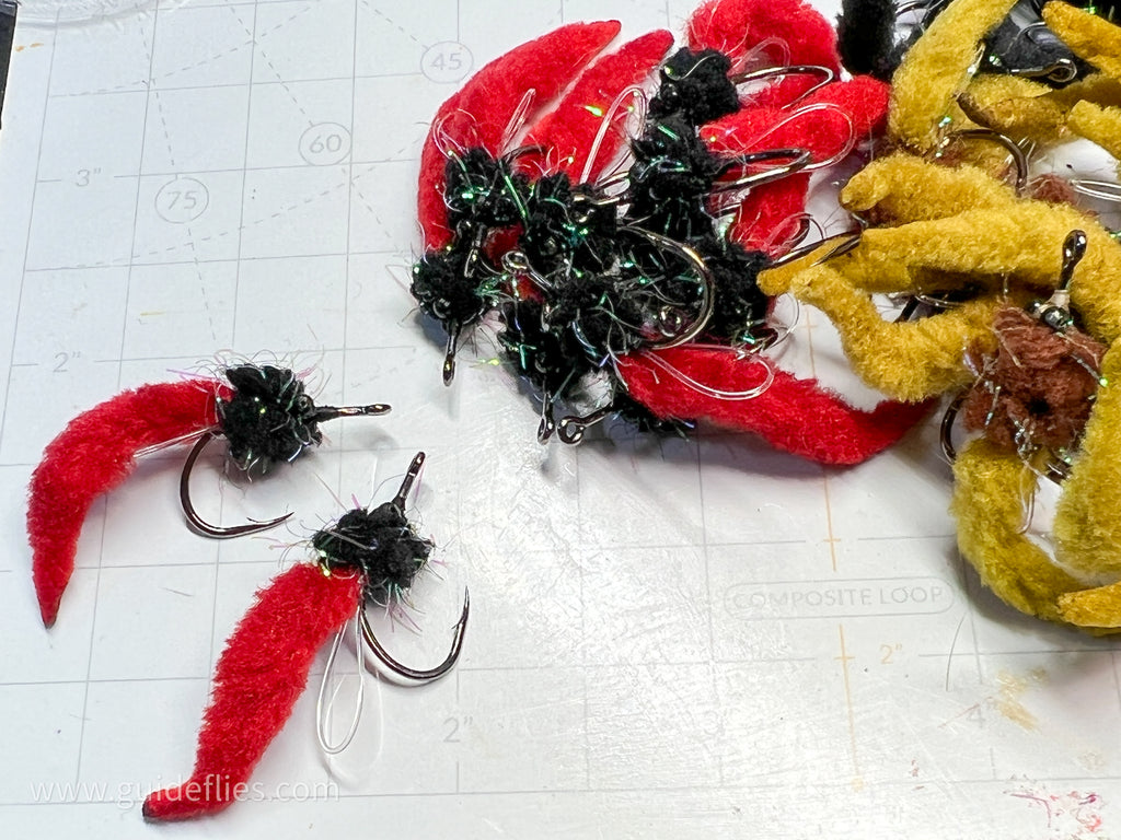 Dave's Tarpon worm colored black and red tails made with Guard hair chenille and aggressive hooks