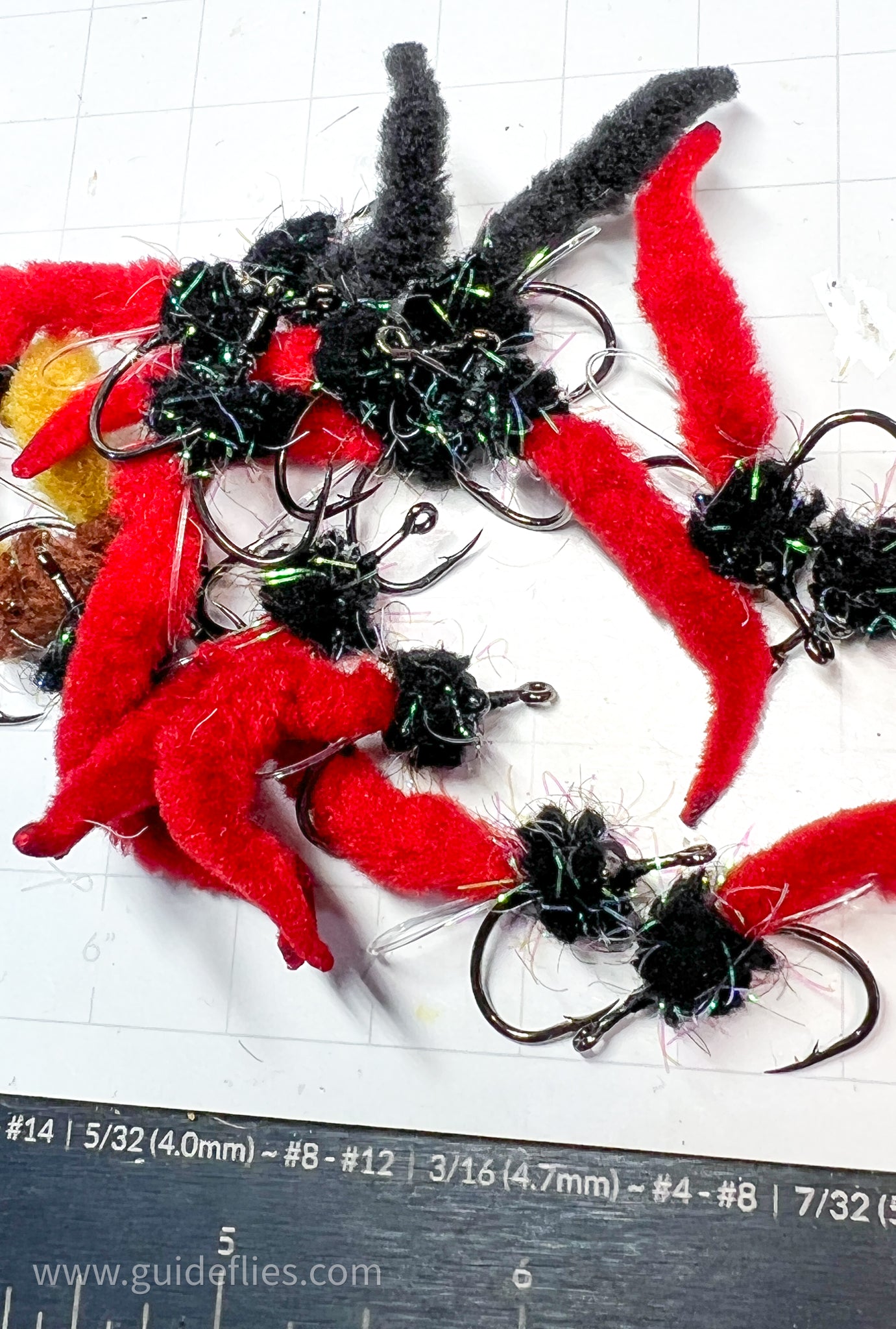 Bundle of the Dave's Tarpon worm colored black and red tails made with Guard hair chenille