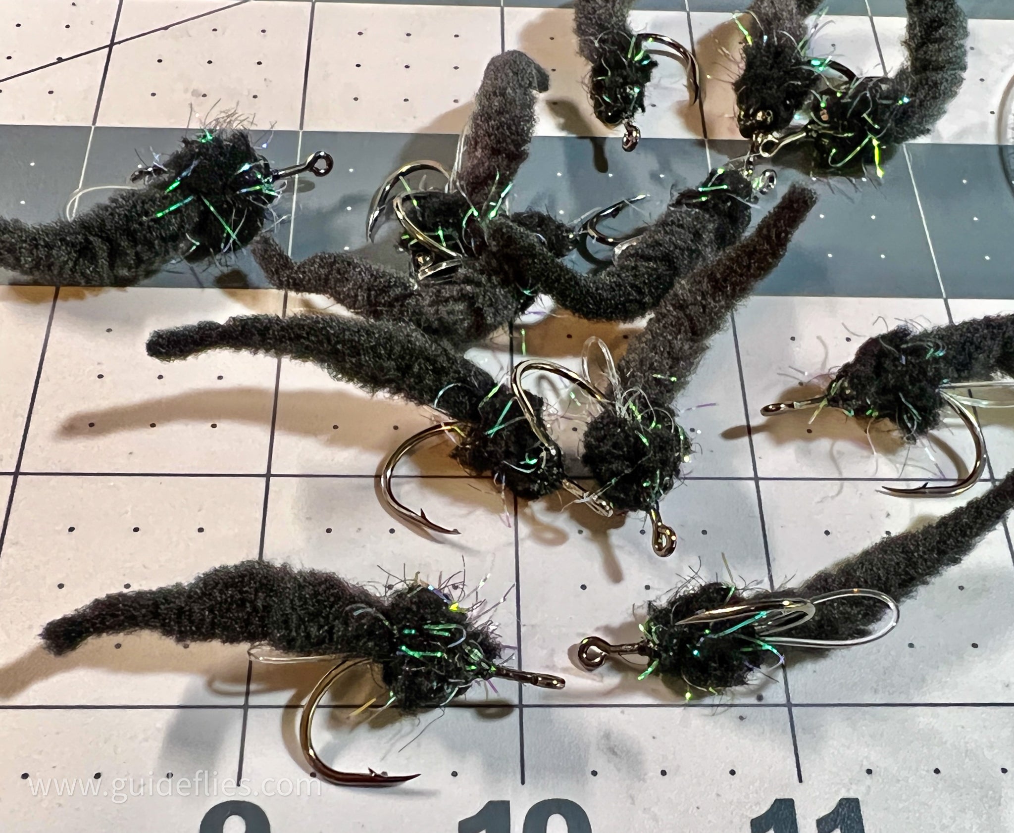 Bundle of the Dave's Tarpon worm colored black bodies and matching tails made with Guard hair chenille