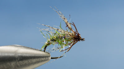 Created with Partrige soft-hackle wraps this green and brown EDC Caddis is small to carry around