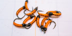 Fluorescent Nano Glow Caddis Transparent strands of Semperfli's Fluorescent Flat Braid Semperfli Fluoro Brite thread thin coat of Solarez UV Resin Flo Orange