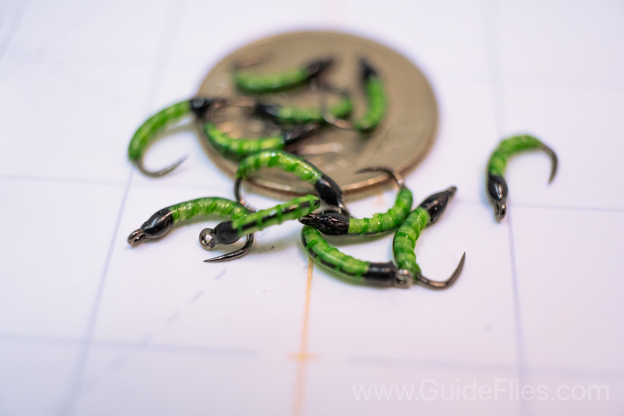 Fluorescent Nano Glow Caddis Transparent strands of Semperfli's Fluorescent Flat Braid Semperfli Fluoro Brite thread thin coat of Solarez UV Resin Bright Green