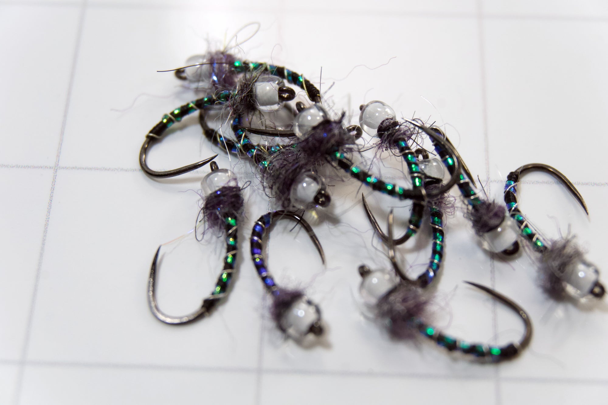 G-Midge Ultra thin Nano Silk Micro Metallic Wire ribbing Micro Pearl UV Body Quill Custom blended UV Rainbow Dub and a pearl-core Killer Caddis glass bead