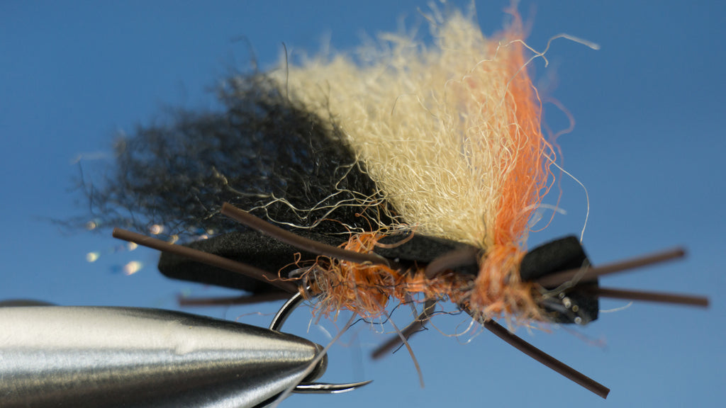 Made with 2 crinkle hair and a firehole outdoor hook colored in orange and black